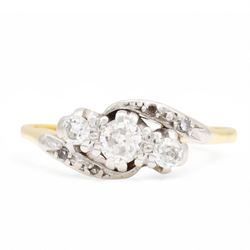 18ct gold diamond crossover ring, set with three old cut diamonds and two diamond chips ei...