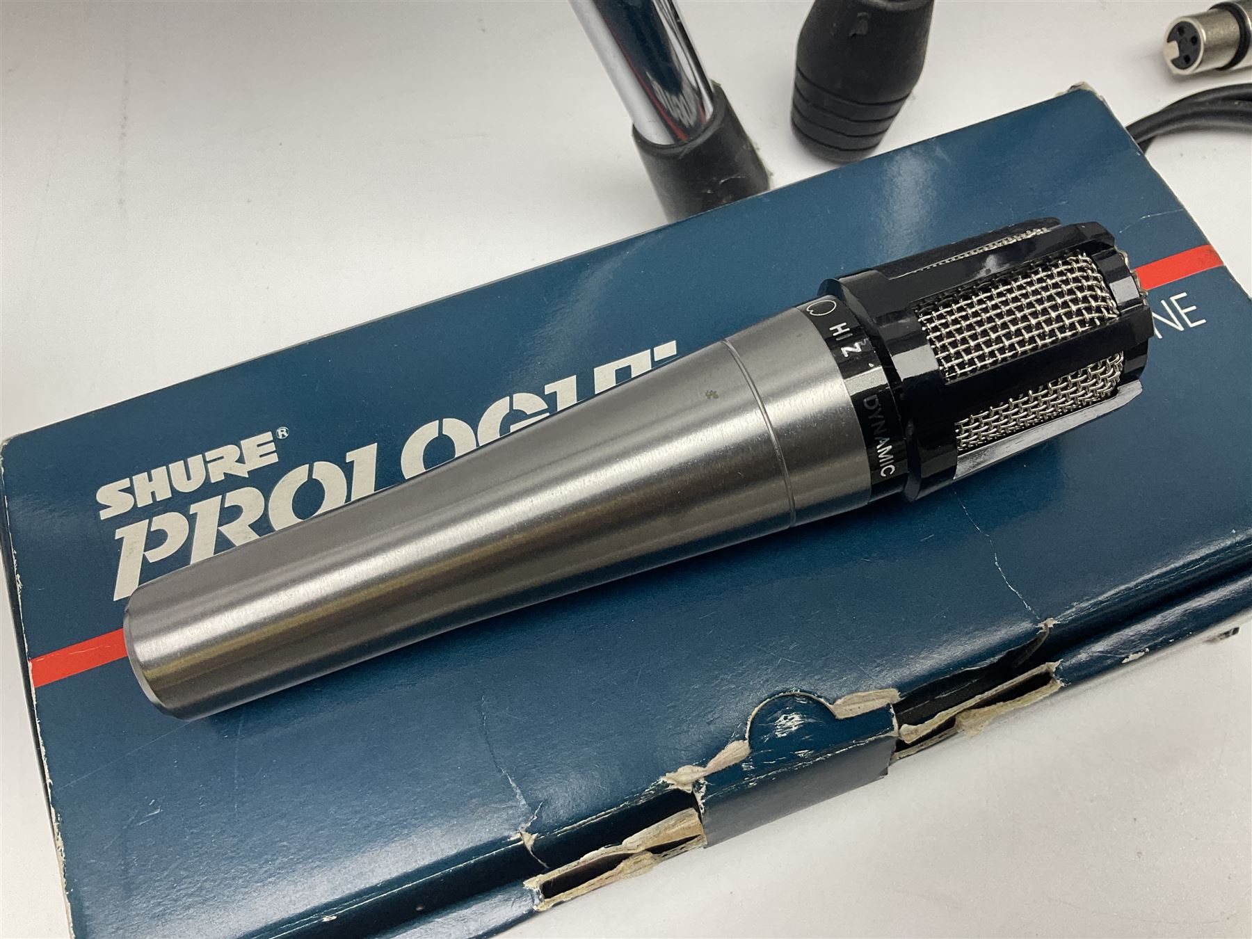 Shure SM58 Dynamic microphone; in original bag with paperwork; Shure Prologue 10H-LC Dynamic microphone; boxed; each with cable and tubular chrome adjustable stand (4)