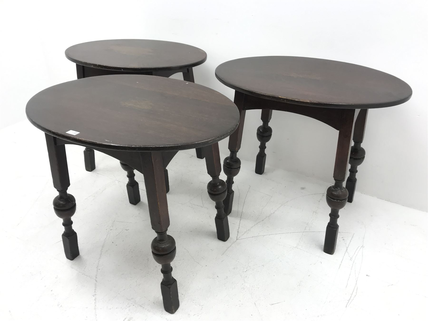 Three oval bog oak bar tables, square supports with cup and cover detailing