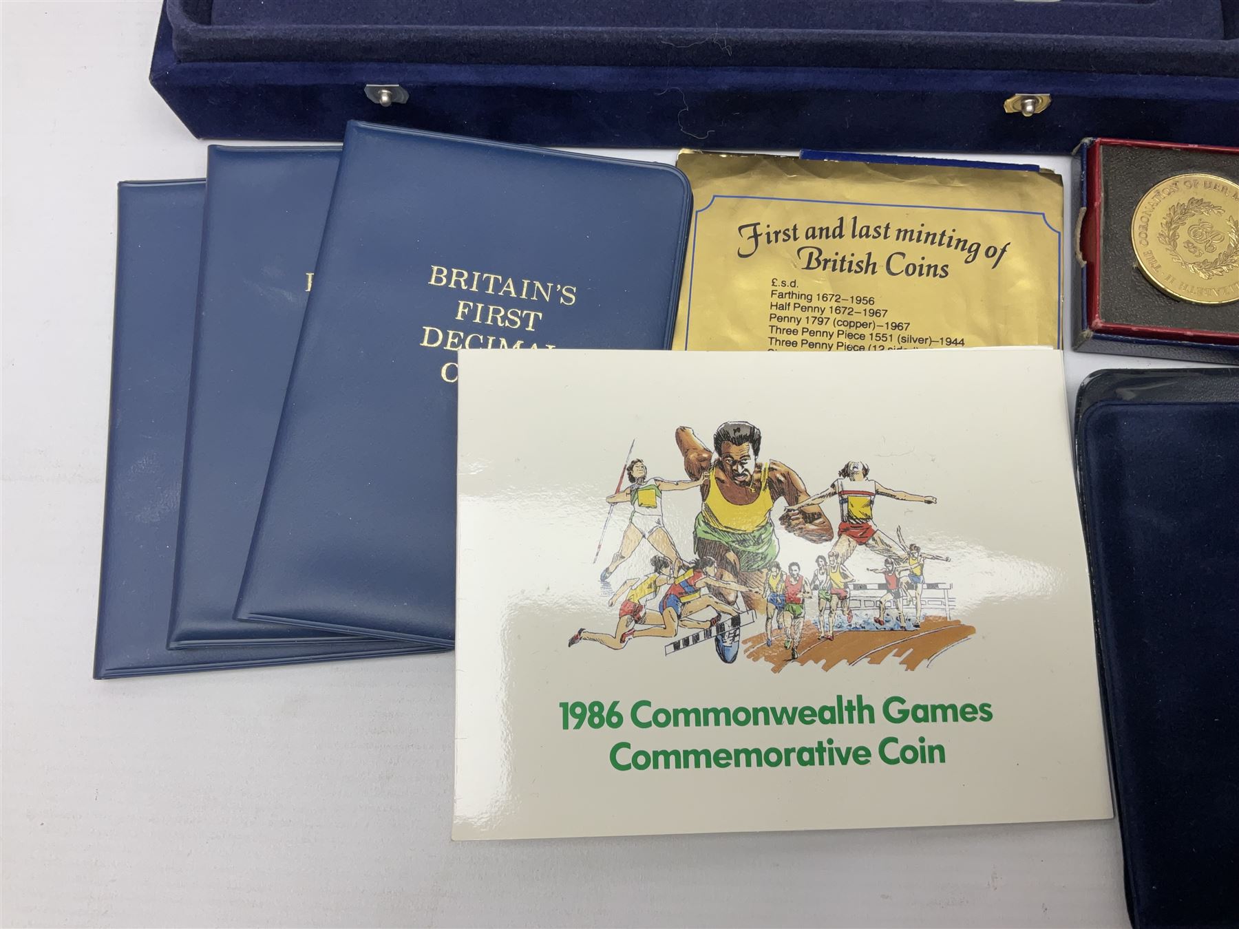 Mostly commemorative coins, including crowns, Queen Elizabeth II 2009 countdown to London 2012 five pound coin on card, 'The 2012 Diamond Jubilee' coin set in card folder, Cook Islands 2013 one dollar commemorating 'Coronation sixty years 1953 2013' etc