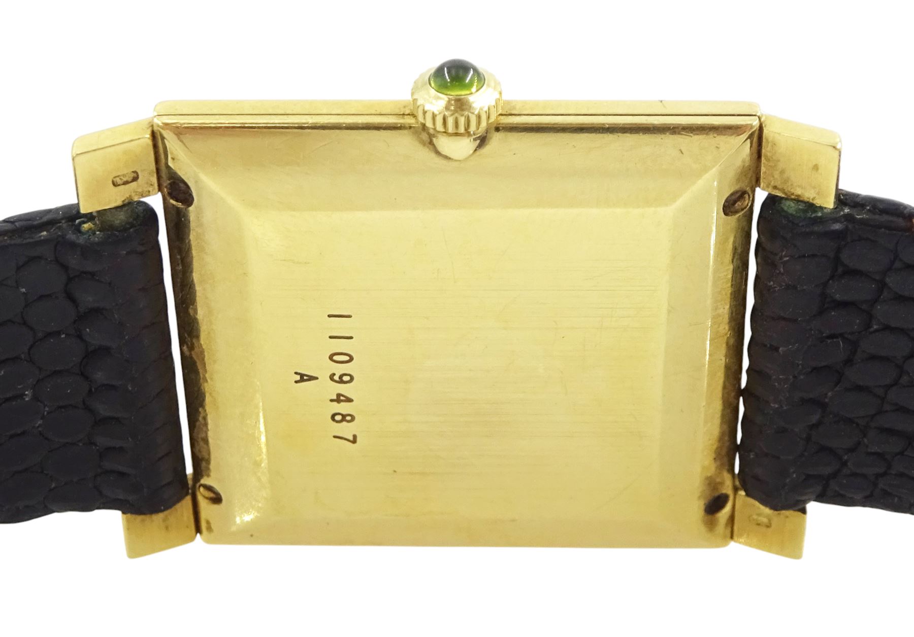 Jaeger LeCoultre gentleman's 18ct gold square cased manual wind wristwatch, champagne dial with yellow sapphire quarter markers, cabochon green sapphire crown, case No. 1109487, on black leather strap