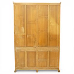 Beaverman - Yorkshire oak open bookcase, with adjustable shelves, panelled sides and lower cupboard doors, with carved beaver signature, by Colin Almack of Sutton near Thirsk