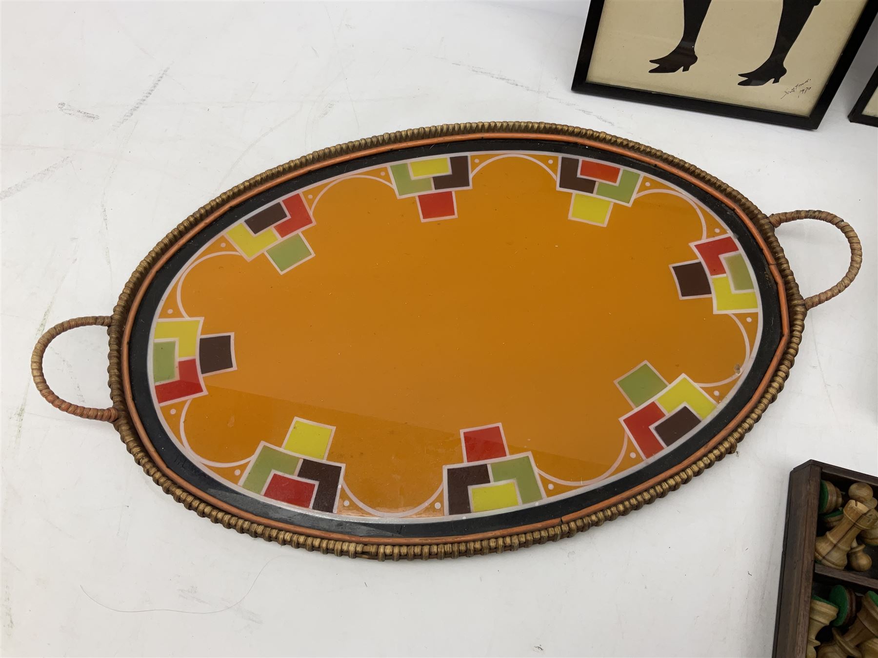 Two Scott-Ford framed silhouettes, featuring the standing profile study of a man dated 1929 and a pair of women dated 1929 and 1930, together with a box containing wooden chess pieces and a serving tray 