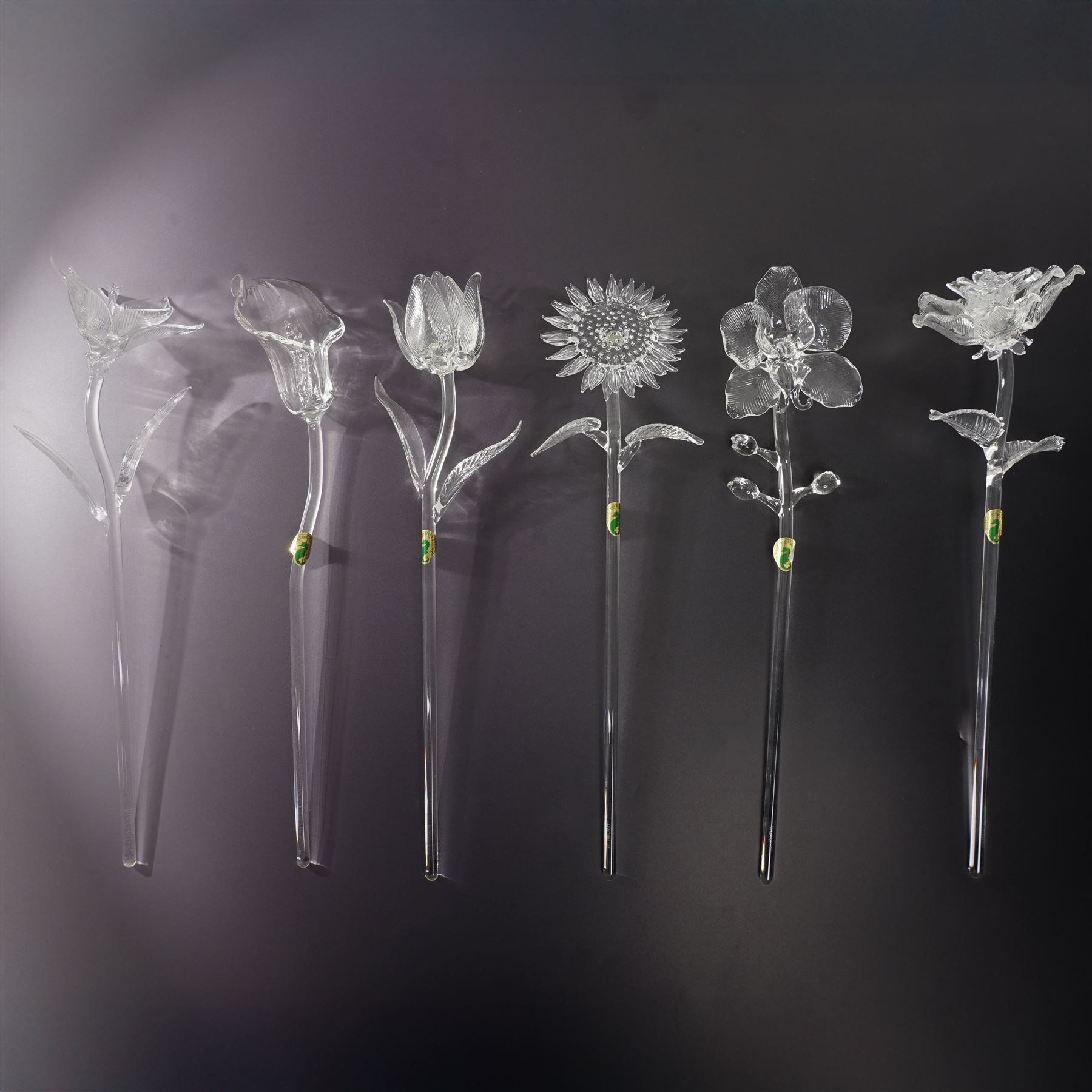 Set of six Waterford Crystal flowers, to include Fleurology Sunflower, Tulip, Lily, Rose, and others not Fleurology comprising Orchid and Calla Lily, in original boxes