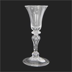 Mid 18th century wine glass, circa 1730-1740, with bell shaped bowl upon an inverted balus...