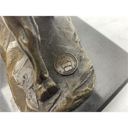 Bronze figure, modelled as a prancing bull, upon a naturalistic base signed Mils and with foundry mark, raised upon a rectangular marble base, overall H14cm