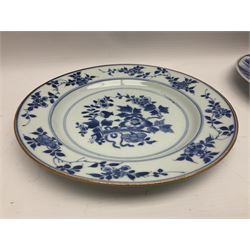 Japanese Meiji period Arita blue and white plate, of circular form, painted with riverside landscape and bird upon flowering branch, with character mark beneath, D24.5cm, together with two 18th century Chinese blue and white plates, each painted with floral design, each approximately D22.5cm