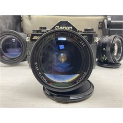 Canon A1 35mm camera body serial no 741264, with 'Tokina AT-X 28-85mm 1:3.5-4.5' lens serial no 821679, 'Canon FD 50mm 1:1.8mm' lens and other camera equipment 