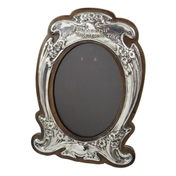  Art Nouveau silver on oak photograph frame embossed flower decoration, inscribed Friendship is a Sheltering Tree, Coleridge Rd No.413303by  J. Aitkin & Son, Birmingham 1907   