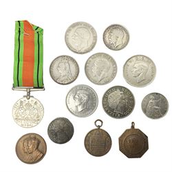 Victorian and later coins, to include Queen Victoria 1889 double florin coin, King George V 1918 half crown, two King George V crowns dated 1935 and a King George VI 1937 crown etc, together with a Defence Medal and two Society of Miniature Rifle Club medals 
