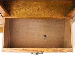 Maple & Co. - Arts & Crafts oak dresser with stained glass cupboard, raised section with pierced pediment above a mirrored back, with a stained glass fronted cupboard with fixed shelf, single long drawer, above a pair of fielded panels, with open recess above a short drawer, raised above a full length undertier with turned supports