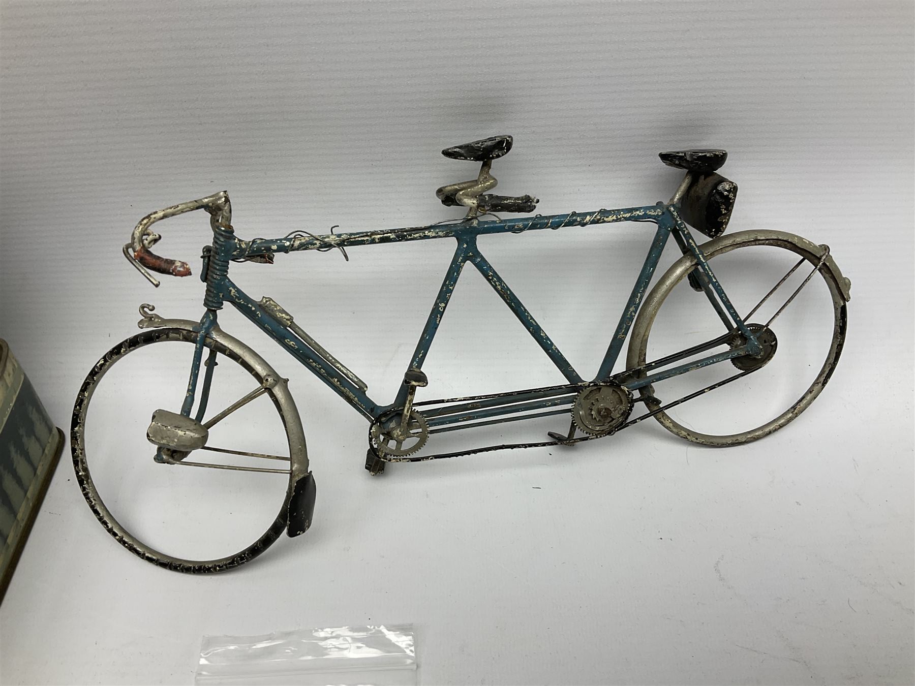 Chad Valley clockwork Fordson Major Tractor, a group of play worn Britains and other lead and metal farm animals, figures and accessories including a kennel, haystacks, dovecote, cows, sheep etc, together with a diecast model of a Tandem Bike L31cm