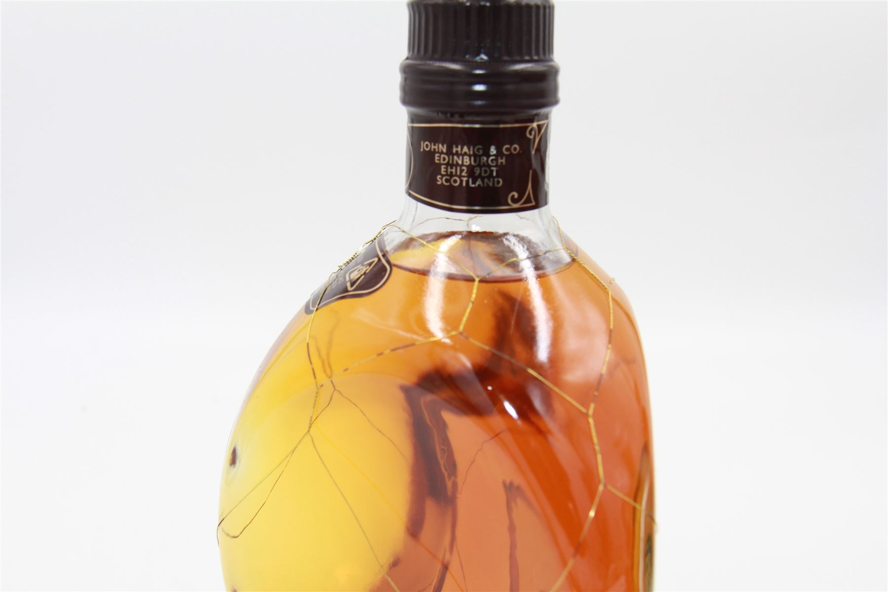 Three bottles of John Haig & Co whiskey, comprising The Original Dimple, 15 year old de luxe Scotch whisky 70cl, 40% Vol and two Dimple, Old Blended Scotch whiskey 20fl oz 70% proof (3)