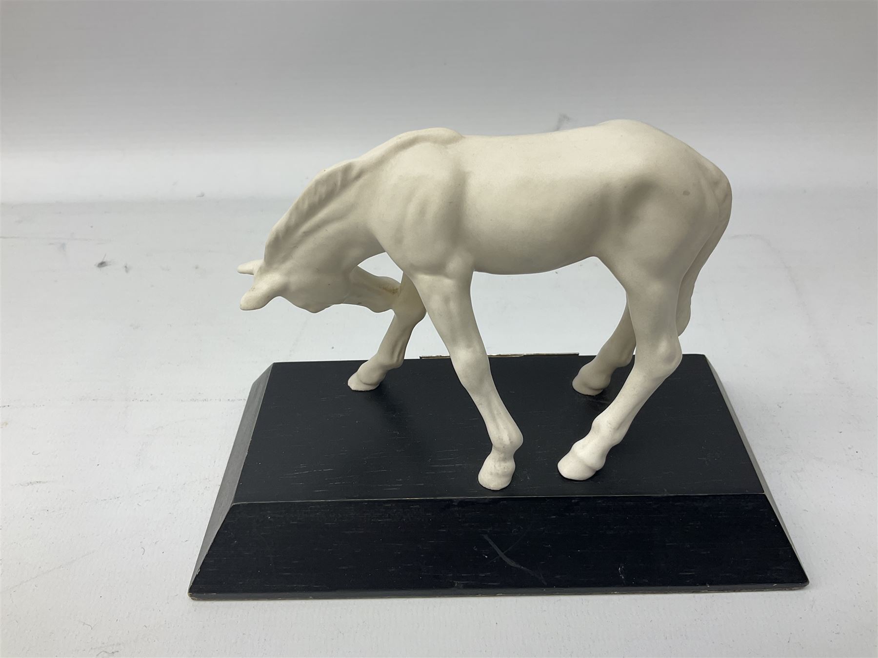 Collection of Beswick horses, including grey horse no.701, palomino foal no 836, grey stocky jogging mare no.855 etc, together two Royal Doulton horses, (8)