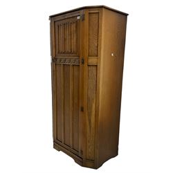 Early to mid 20th century oak hall wardrobe, single door with linenfold panel