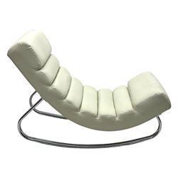 Cream leather modernist rocking chair, leather upholstery with horizontal channel stitching, supported by a chrome-plated tubular frame 