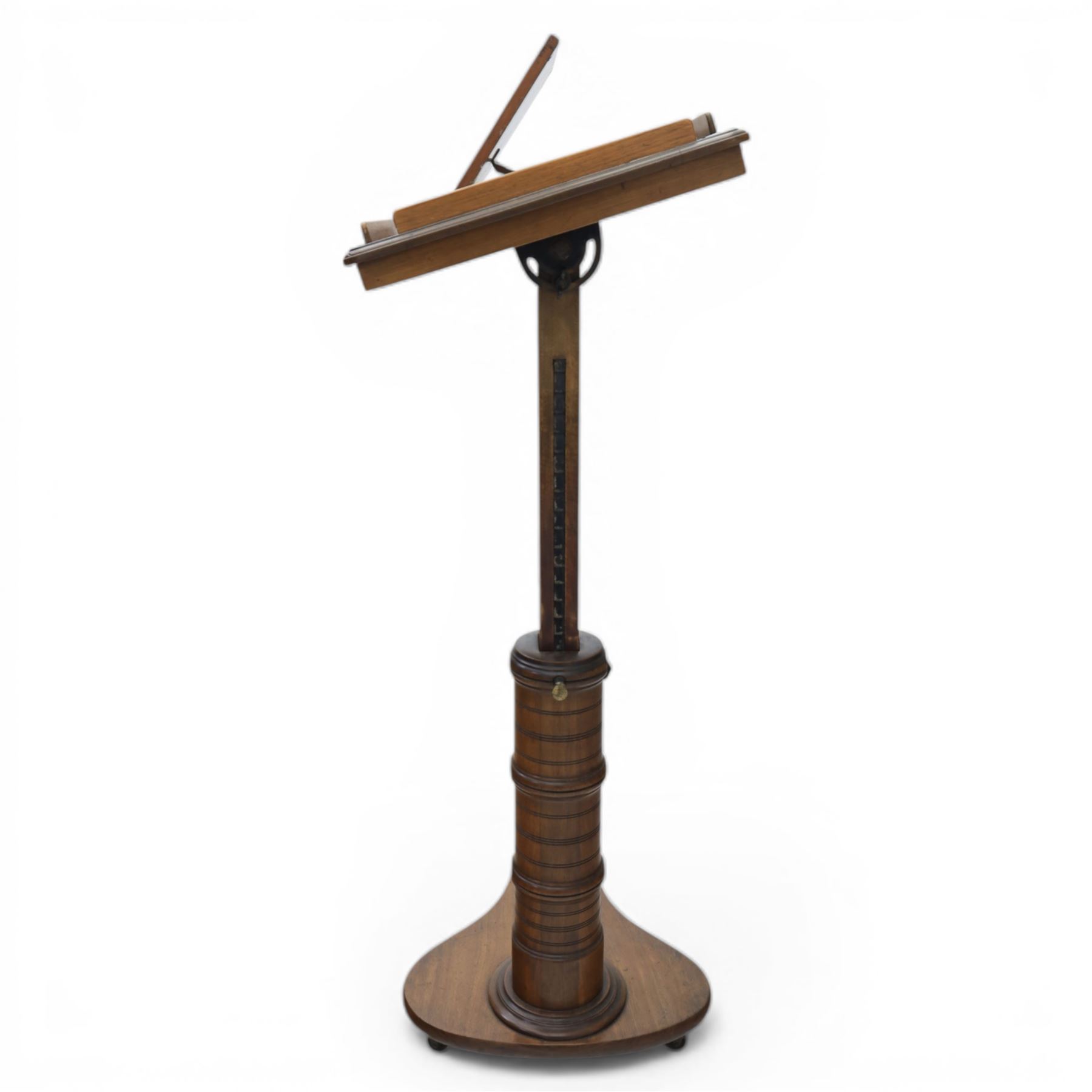 Late Victorian mahogany adjustable reading stand, the rectangular top with moulded and rounded edge and gallery upon a adjustable turned column support, and shaped base
