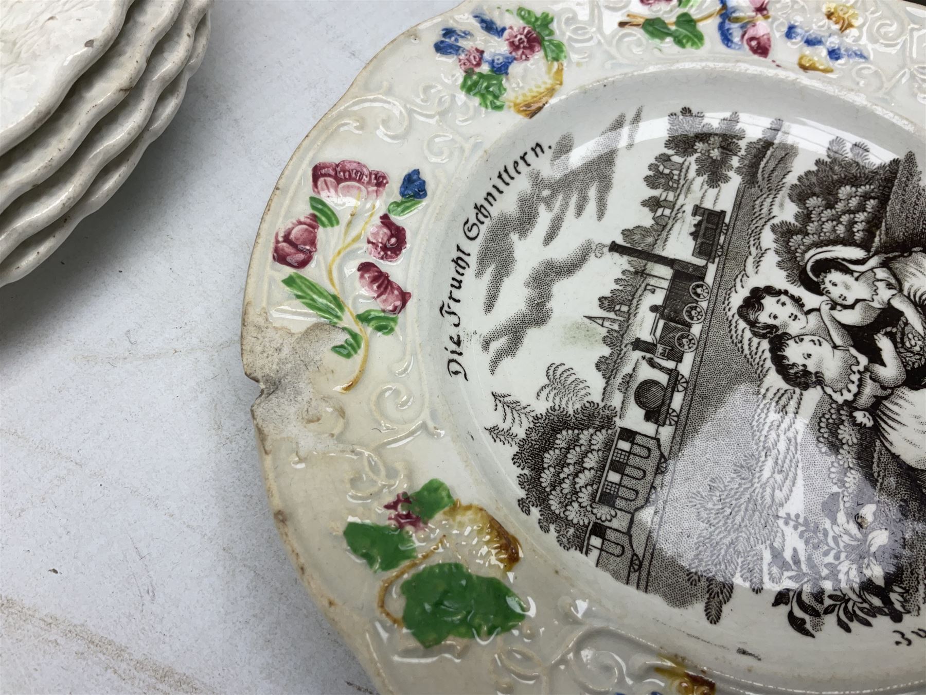 Collection of 19th century William Smith & Co nursery plates, to include examples decorated in the pastime series, and similar, all with moulded floral borders