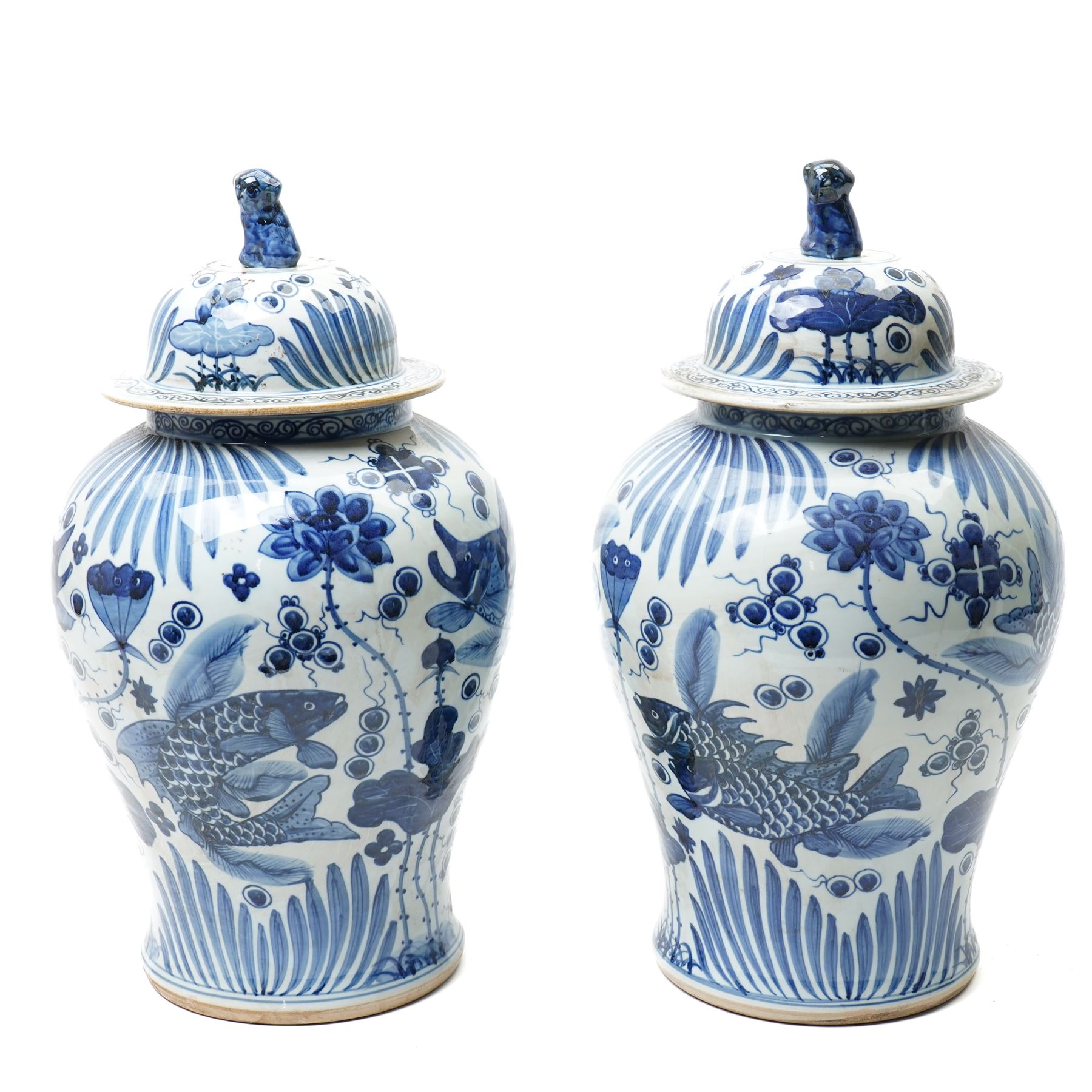 Pair of Chinese blue and white jars and covers, of baluster form, hand painted with fish and foliage, H50cm