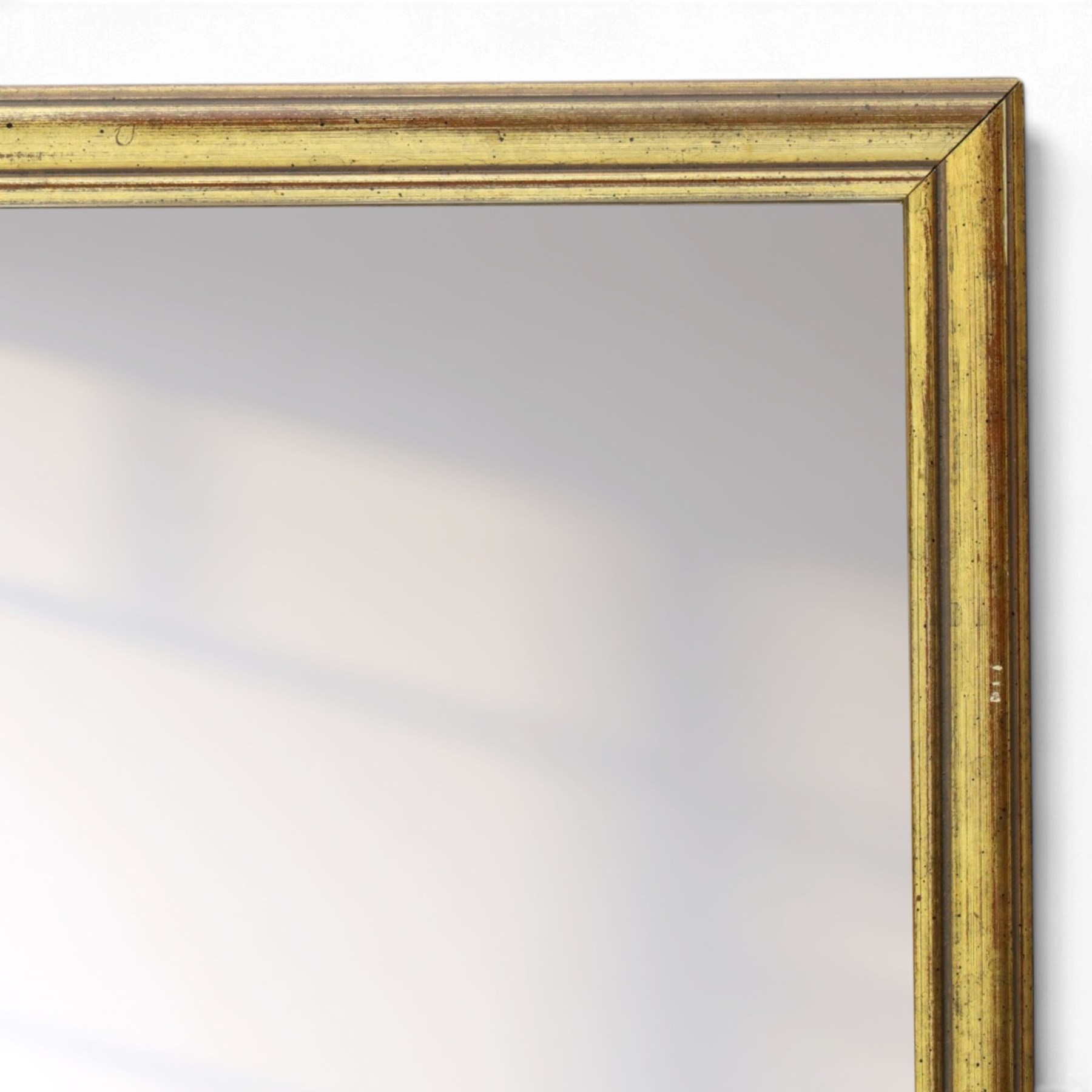 Contemporary giltwood wall mirror, of rectangular form with moulded frame