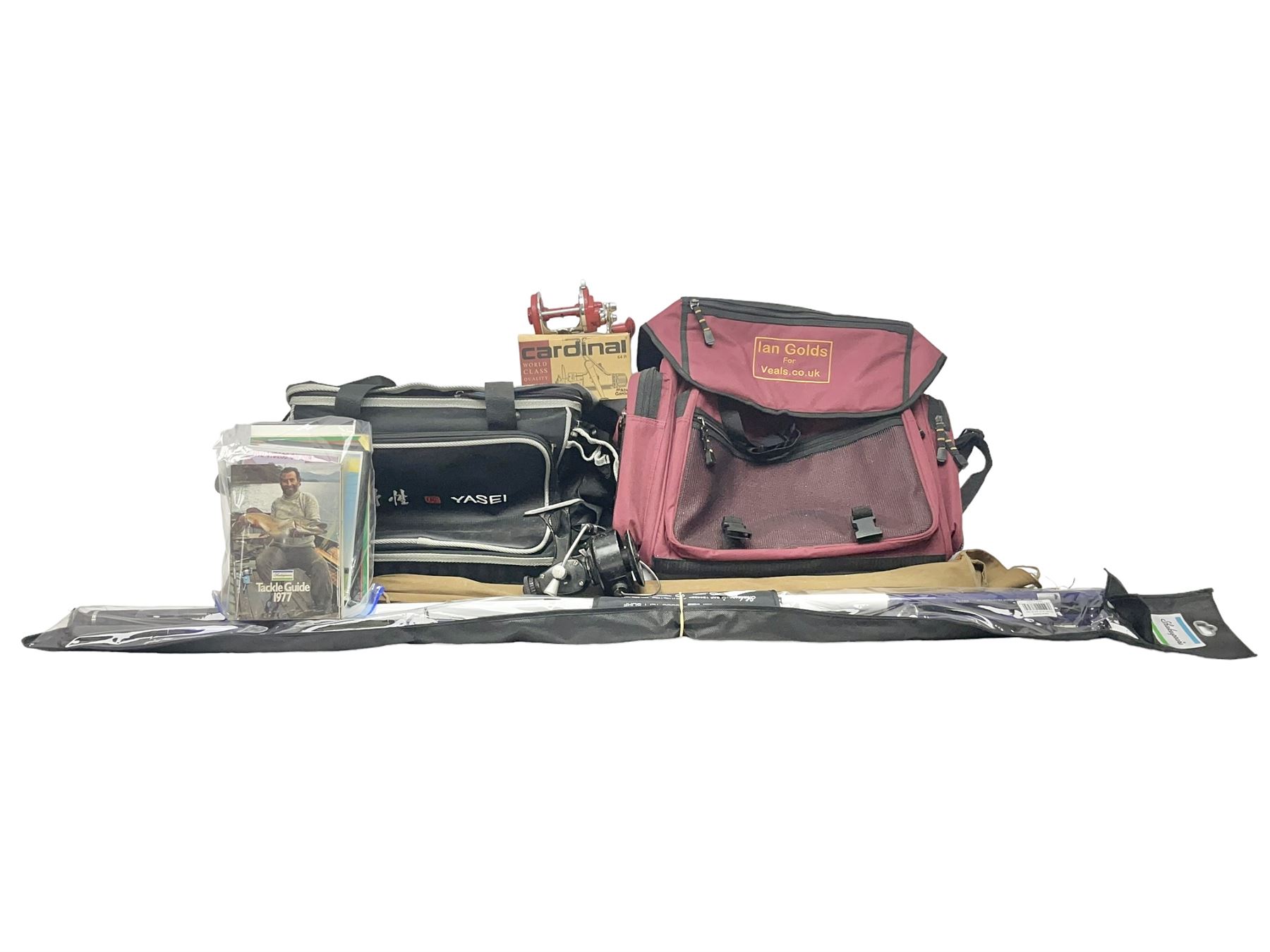 Collection of fishing memorabillia and equipment, including an Allcocks three piece split cane trout fly rod, Shakespeare Salt 3600 surf rod, two tackle bags, Old Red Seastreak multiplier reel, Sportext Saltwater fixed spool reel, fishing dvds, etc