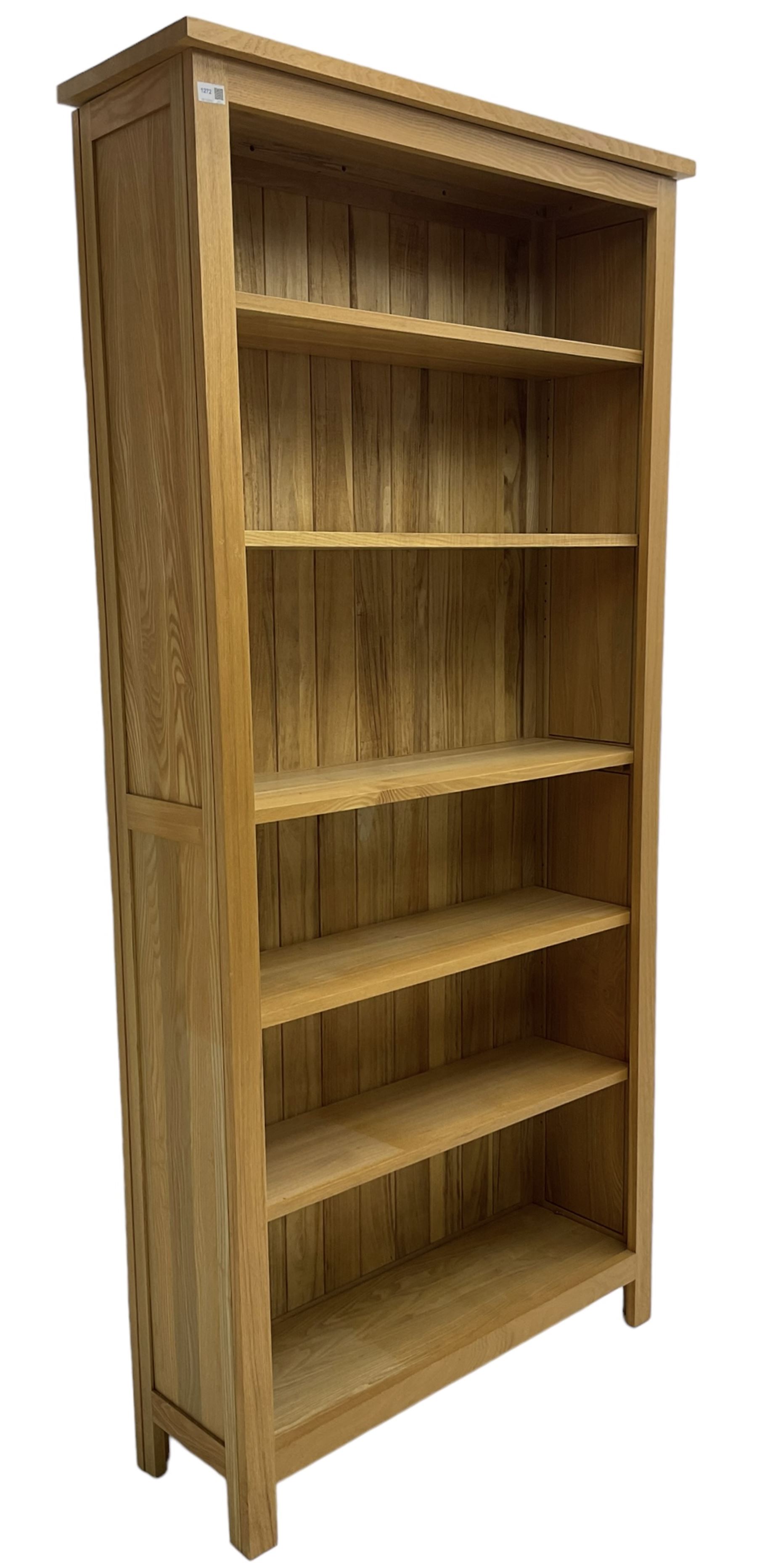 Contemporary light oak open bookcase, fitted with five adjustable shelves