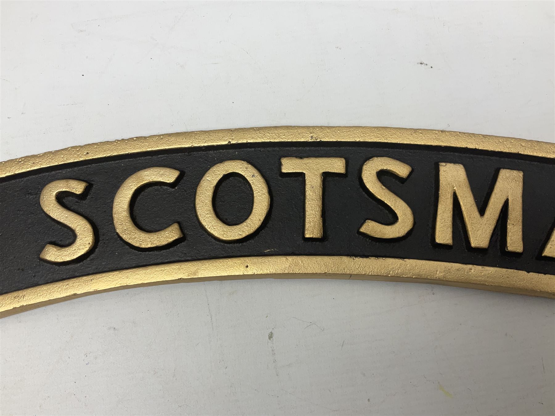 Cast iron Flying Scotsman arched railway type sign, L70cm