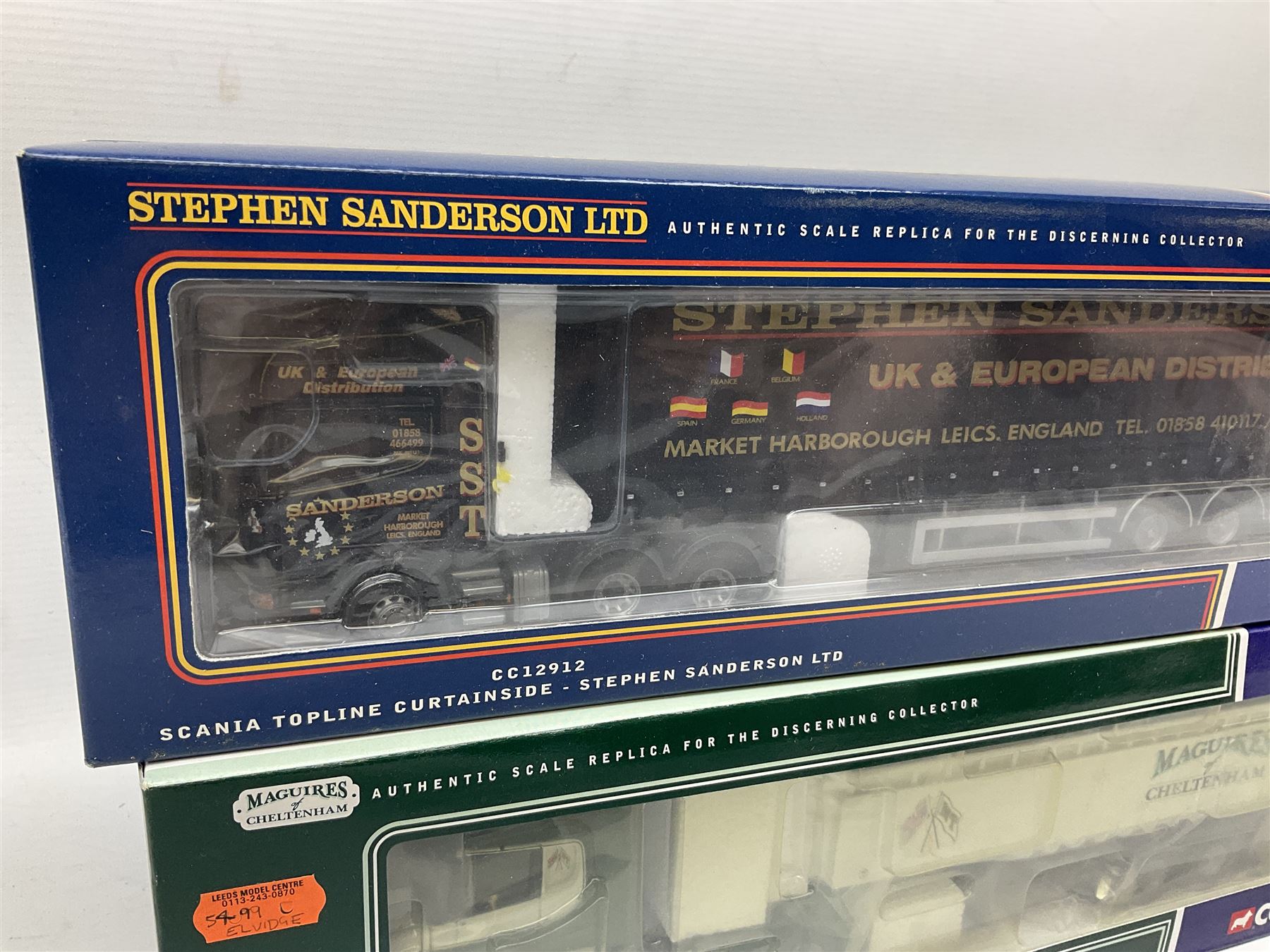 Three Corgi 1:50 scale lorries - ERF Tanker - Gulf Oil in perspex display case No.75101; limited edition Scania T Bulk Tipper - Maguires of Cheltenham No.CC12803; and Scania Topline Curtainside - Stephen Sanderson Limited No.CC12912; all boxed (3)