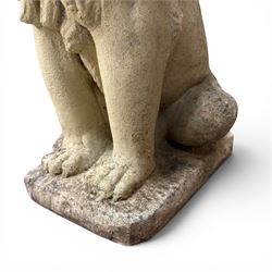 Pair of cast stone garden lions, seated on rectangular plinths