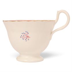 Late 19th century tea service, decorated with a green and pink strips, with internal decoration of budding branch within a gilt band upon a white glazed ground, comprising  twin handle lidded sucrier, milk jug, three serving plates, nine cups and saucers and four teacups