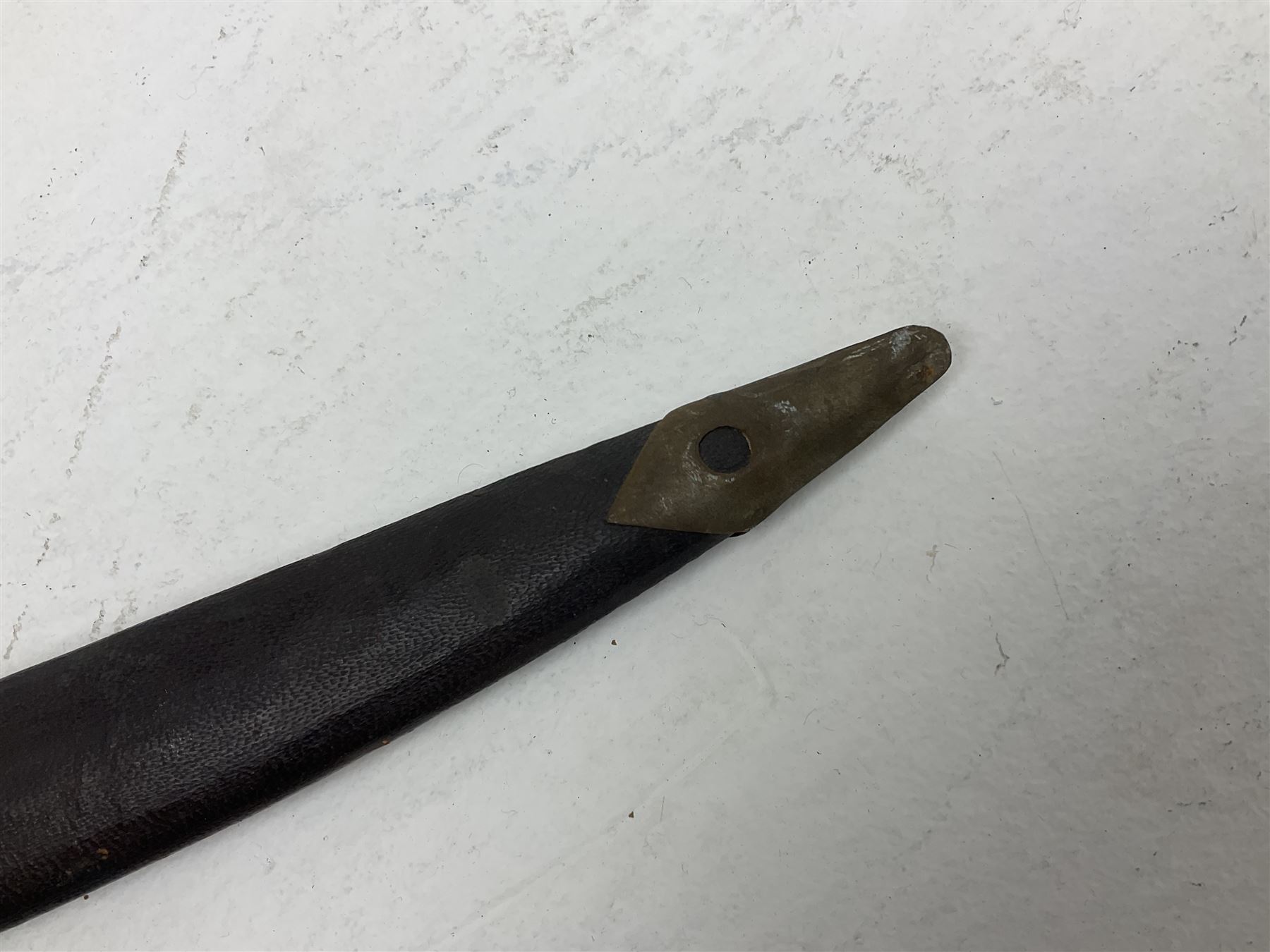 Late 19th/early 20th century Indian Tulwar sword with 81cm plain curving steel blade and iron hilt with extended langets, knucklebow and spiked pommel; in leather covered scabbard L100cm overall; and another Tulwar lacking scabbard in almost relic condition (2)