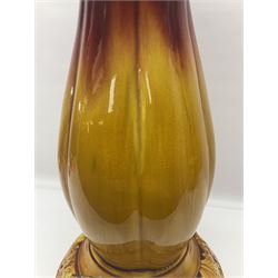 Bretby Jardiniere and stand, with foliate and foliage decoration with a red and yellow ground, impressed mark beneath H94cm
