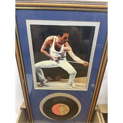 Mostly Queen and Freddie Mercury interest items, including pin badges, newspaper cuttings, diecast 'promotional' vehicles, special edition Pop Rocks figure of Freddie Mercury, VHS tapes, two charity certificates signed by Brian May and Roger Taylor, poster etc, in two boxes 