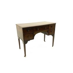 19th century mahogany kneehole dressing table desk, moulded rectangular top over five drawers, square tapering supports with brass and ceramic castors