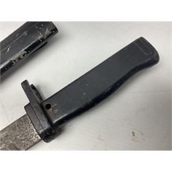 British No 7 MKI knife bayonet with 20cm single edged fullered clipped point blade;  blackened steel, large muzzle ring cross-guard; blackened swivelling pommel marked 'F5H'; red Tufnol composite grips; in blackened steel scabbard L33cm overall; British Pattern 1888 bayonet with scabbard; and German Ersatz bayonet with scabbard (3)