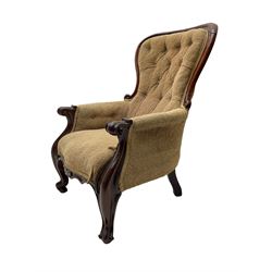 Victorian mahogany upholstered armchair, moulded framed, scroll carved arm terminals on scrolled cabriole supports, shaped carved apron
