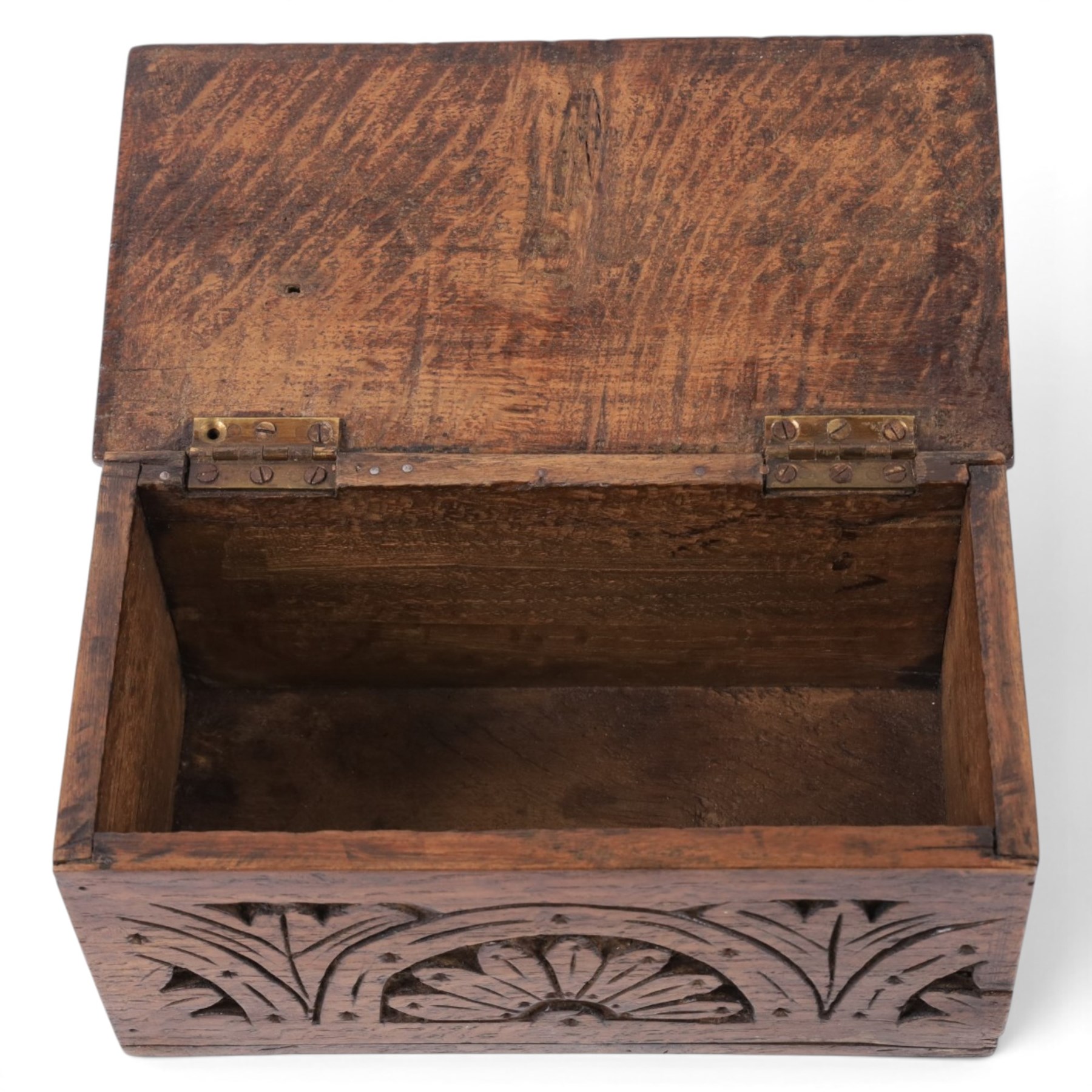 Carved oak box, the hinged lid with a carved diamond motif, the sides and front carved with stylised flowers, H12cm, L24cm