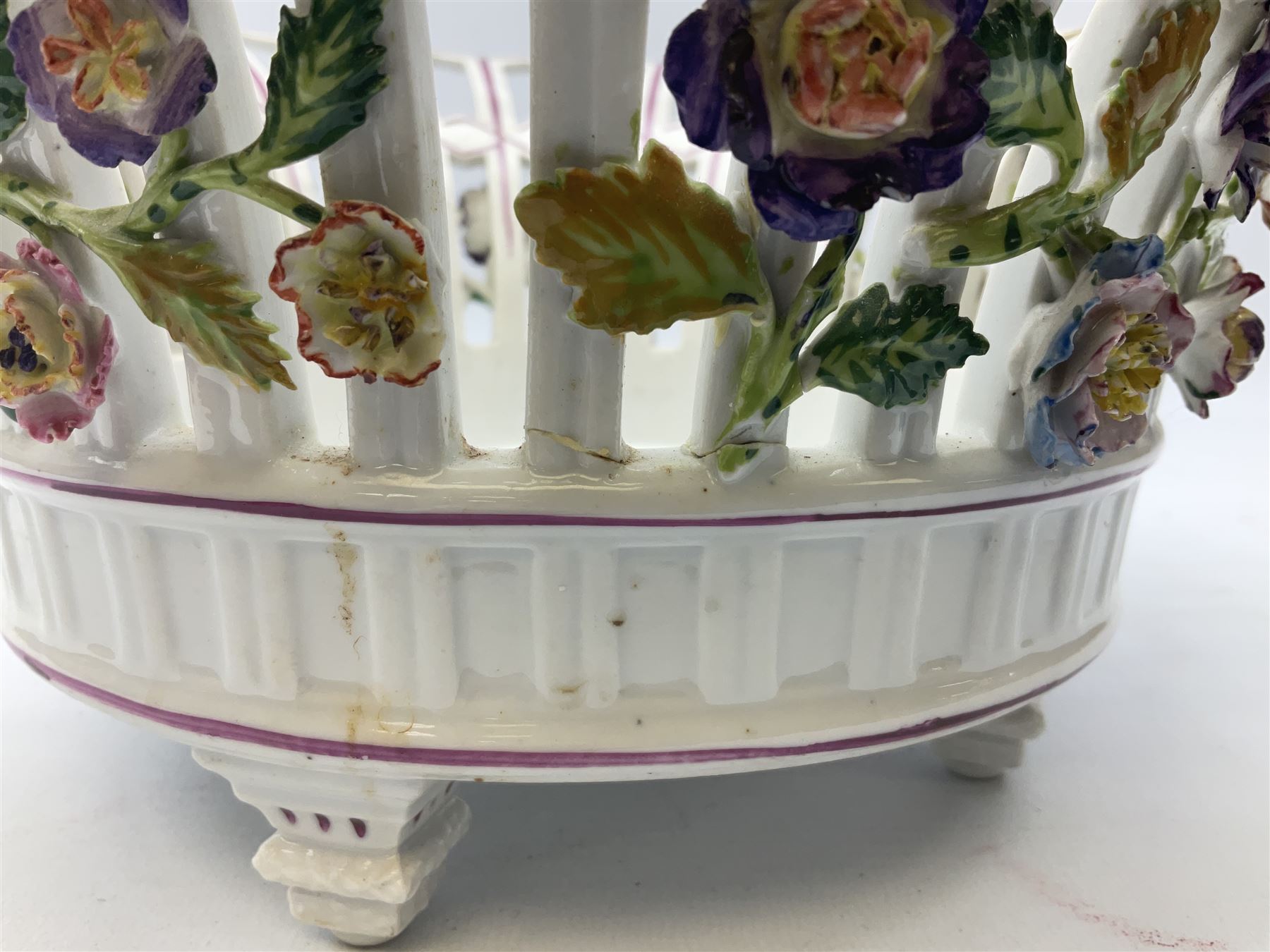 Early 20th century Dresden floral encrusted pierced bowl, centrally painted with flowers, on four tapering supports, D30cm 