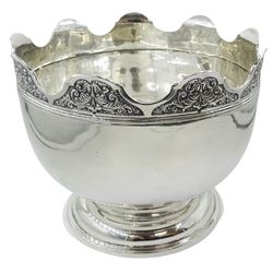 Late Edwardian silver Monteith bowl, the plain body with moulded foliate detailed and shaped rim, upon a circular stepped foot, hallmarked Selfridge & Co Ltd, London 1908, H17cm D21.5cm, approximate weight 31.64 ozt (984.4 grams)

