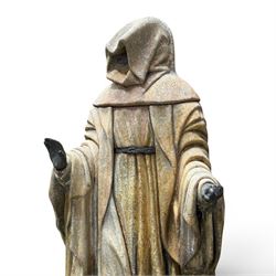 Farran stone garden statue depicting a hooded monk standing in flowing robes in circular form, set upon Gothic pedestal with arched panels, featuring lead hands and script band