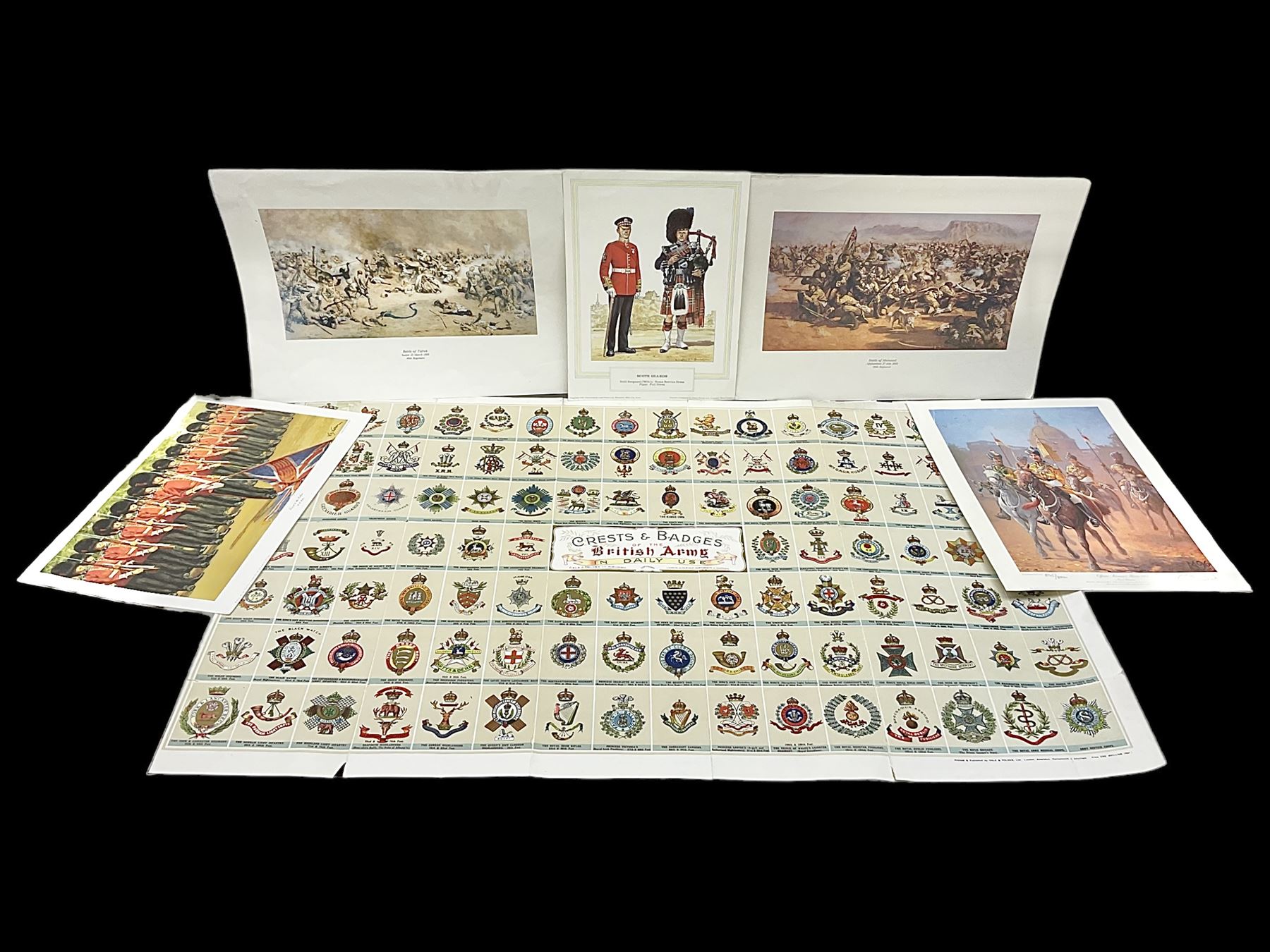 Large poster entitled 'Crests and Badges of the British Army in Daily Use 56 x 86cm; together with twenty-five colour prints of military interest including Crimean War, Boer War, WW2 etc; various sizes; all unframed