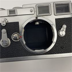 Leica M3 camera body, 1959, chrome finish, serial number '986937', fitted with 'Ernst Leitz GmbH Wetzlar Summicron f=5cm 1:2 Nr.1592614' lens, with Leica M3 instruction booklet