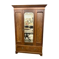 Edwardian mahogany single wardrobe, figured matched veneers to frieze, drawer front and panels, enclosed by bevelled mirror glazed door, base fitted with single drawer, on bracket feet
