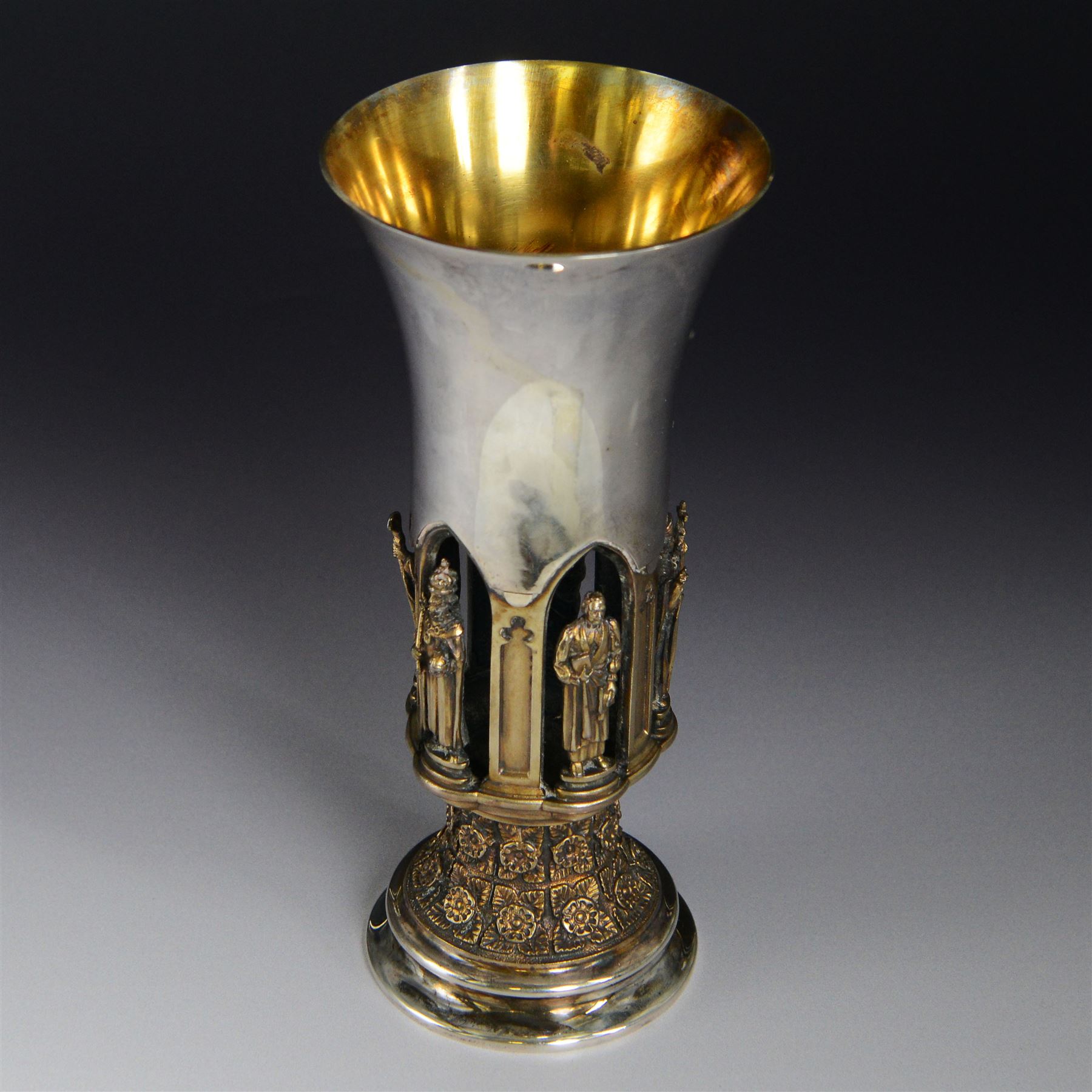 Modern limited edition silver goblet, 'made by order of the Lord Bishop of Ripon to commemorate the foundation of the Diocese in 1836', designed by Hector Miller for Aurum, the plain fluted cup, upon an ornate figural parcel gilt stem and stepped circular foot, no. 112/500, hallmarked Hector Miller, London 1985, H17cm, with certificate
