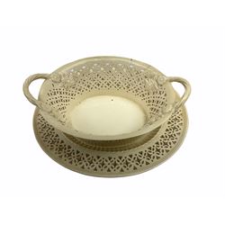 20th century Leeds creamware, comprising chestnut basket and stand, small tureen and cover, ladle, and associated stand, candlestick with stem modelled as a dolphin, teapot, tureen and cover in the form of a melon with fixed stand, and toast rack (toast rack a/f), each with impressed mark beneath. 