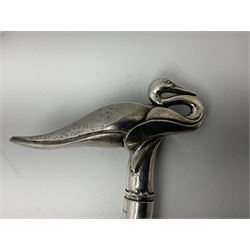 Art Deco style Italian 'Rivestito' covered silver walking stick handle, modelled in the form of a swan, stamped 'R', upon a silver collar hallmarked Birmingham 1986, makers mark DH-L, and hardwood shaft, L96cm

Provenance by vendor repute: 
This walking cane comes from a private collection amassed by the current vendors mother who was an Antique dealer specialising in walking sticks, working at the Portobello Road Antique Market in London for over forty years. 
In 1988 the prop crew from LWT (now ITV) visited Portobello Road looking for, amongst other items, a signature stick for David Suchet to use in his portrayal of Agatha Christie's Poirot. 
At the time this particular walking stick was one of five in possession. The prop crew chose and purchased another of the five which was then used by Suchet throughout all seventy episodes of the much loved series. 
Following the conclusion of the series Suchet was gifted his particular cane, which has been loaned to and can now be seen at the Agatha Christie Gallery at the Torquay Museum. 
