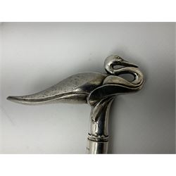 Art Deco style Italian 'Rivestito' covered silver walking stick handle, modelled in the form of a swan, stamped 'R', upon a silver collar hallmarked Birmingham 1986, makers mark DH-L, and hardwood shaft, L96cm

Provenance by vendor repute: 
This walking cane comes from a private collection amassed by the current vendors mother who was an Antique dealer specialising in walking sticks, working at the Portobello Road Antique Market in London for over forty years. 
In 1988 the prop crew from LWT (now ITV) visited Portobello Road looking for, amongst other items, a signature stick for David Suchet to use in his portrayal of Agatha Christie's Poirot. 
At the time this particular walking stick was one of five in possession. The prop crew chose and purchased another of the five which was then used by Suchet throughout all seventy episodes of the much loved series. 
Following the conclusion of the series Suchet was gifted his particular cane, which has been loaned to and can now be seen at the Agatha Christie Gallery at the Torquay Museum. 
