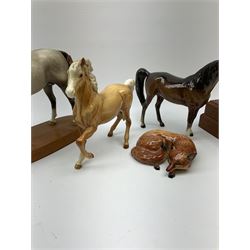 A group of assorted figures, comprising Beswick Arab 'Bahram' Connoisseur' horse, model no 1771, Beswick Palomino horse, model no 1261, Beswick brown Arab 'Xayal' horse, model no 1265,  Beswick fox, model no 1017, and a ceramic horse head on wooden plinth. 