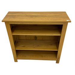 Light oak open bookcase, fitted with two adjustable shelves