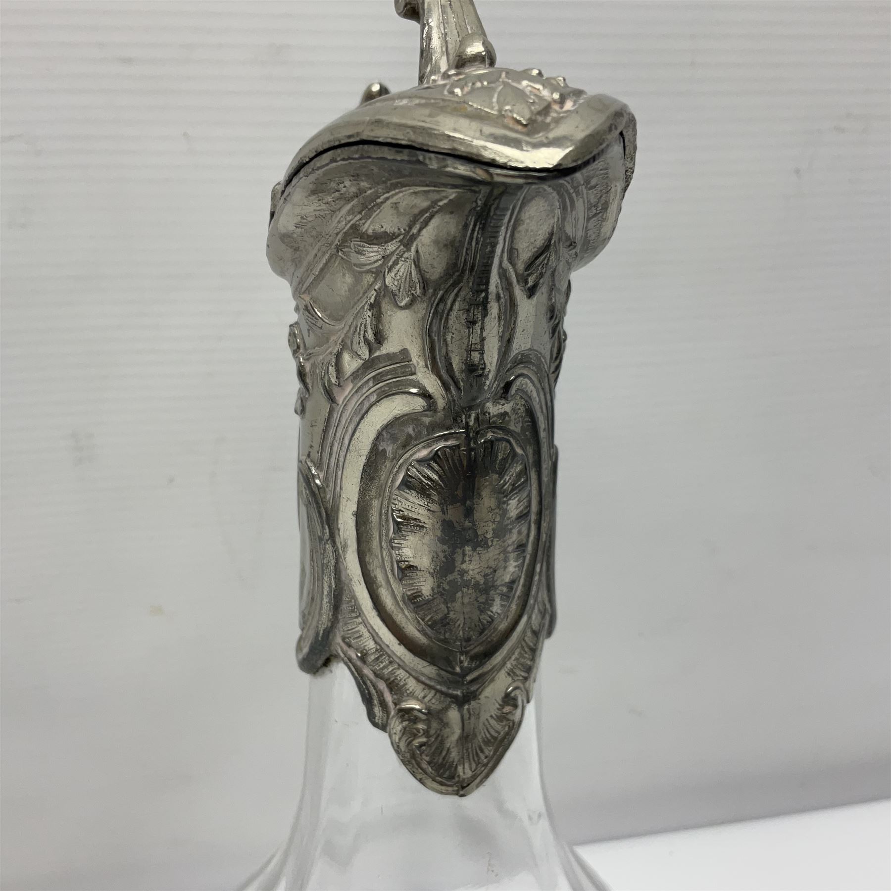 Silver plate mounted blue glass claret jug of ovid form, with C scroll handle, together with two other silver plate mounted claret jug